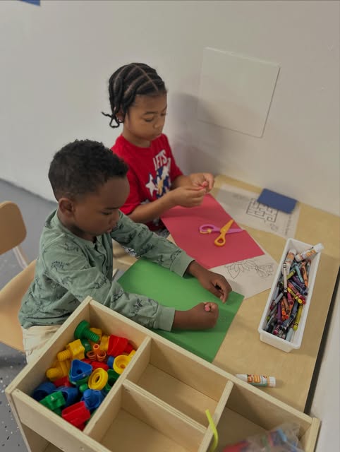 Students working on crafts at Jah's Learning House